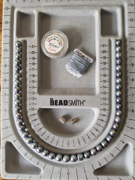Step 1: Pearls arranged in the exact order of stringing.