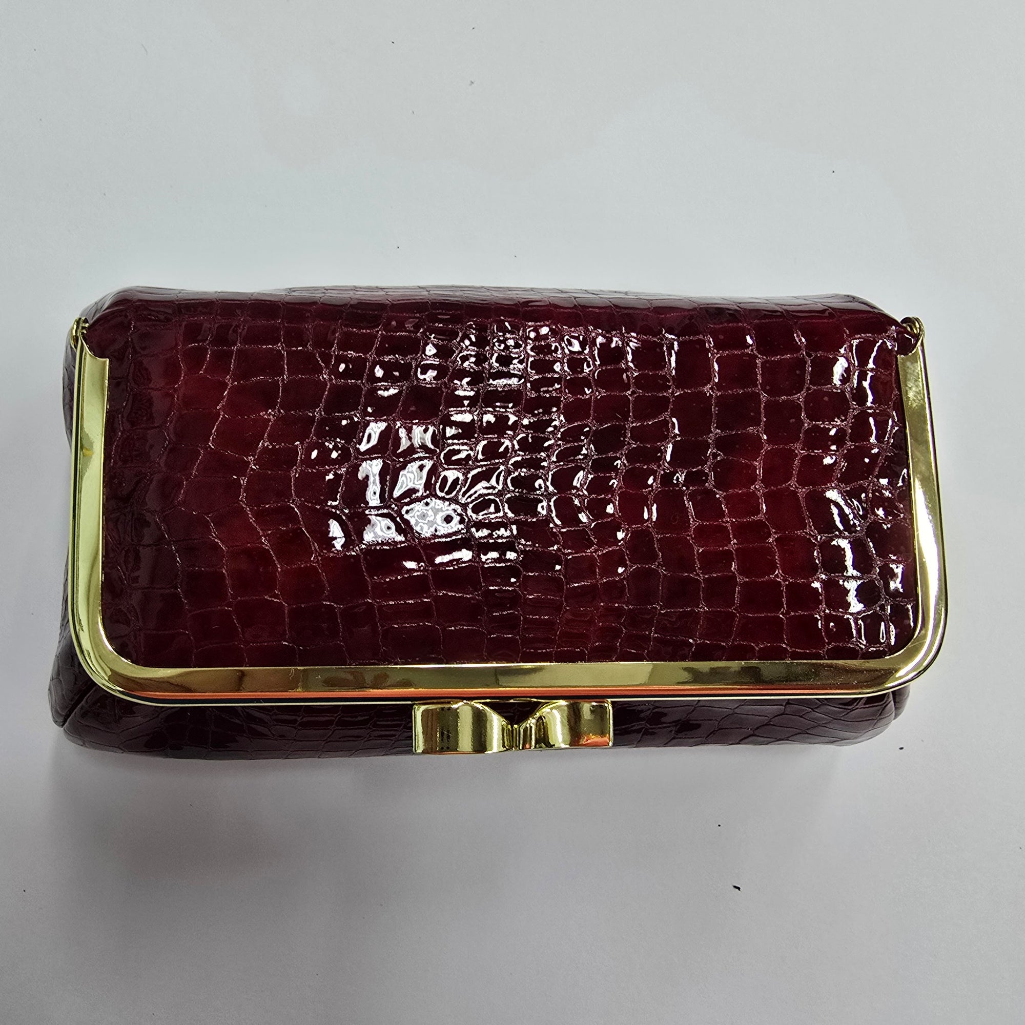 Laquered Red Snake Genuine Leather Travel Bag Gold frame sky view