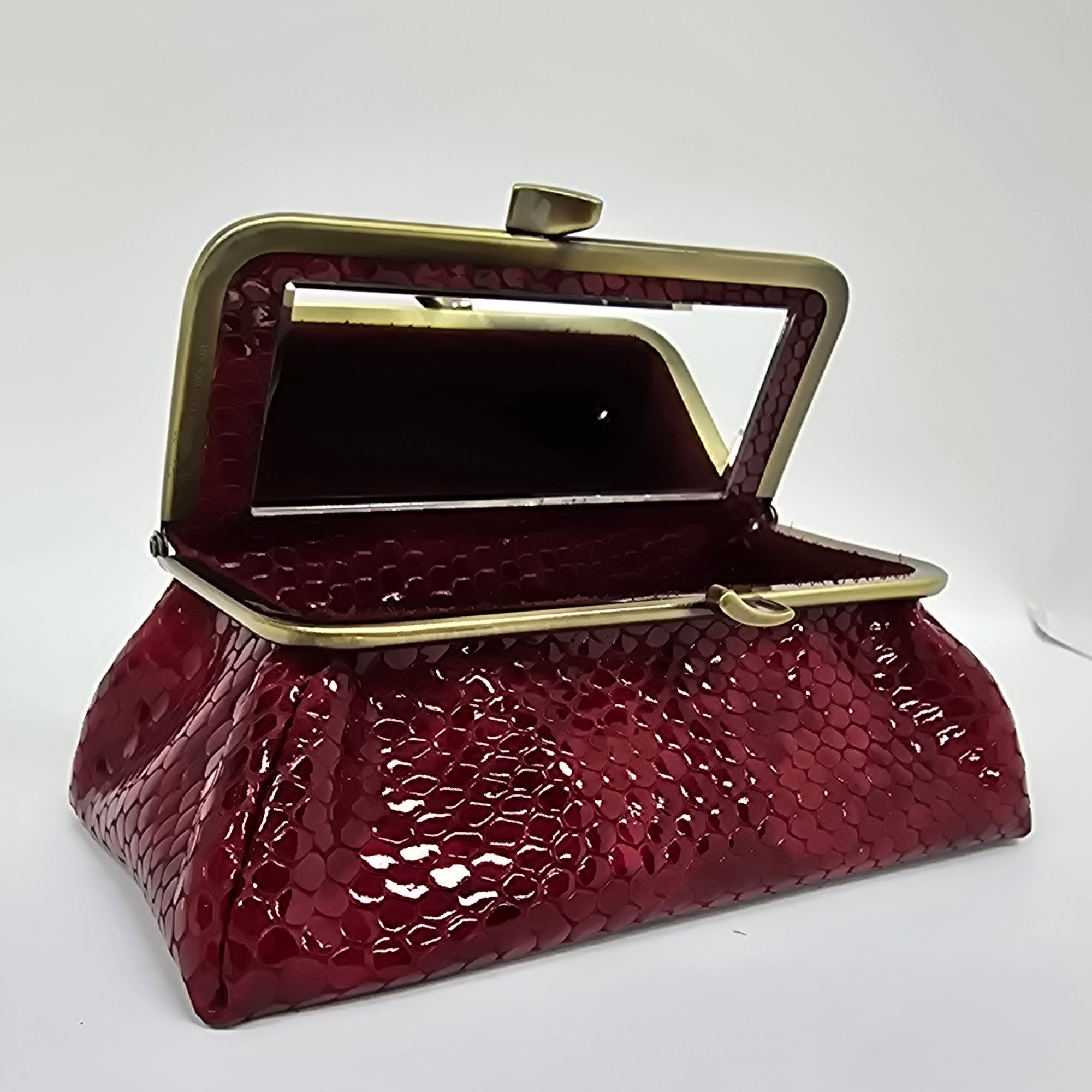 Laquered Red Snake Genuine Leather Travel Bag brushed bronze frame front view opened