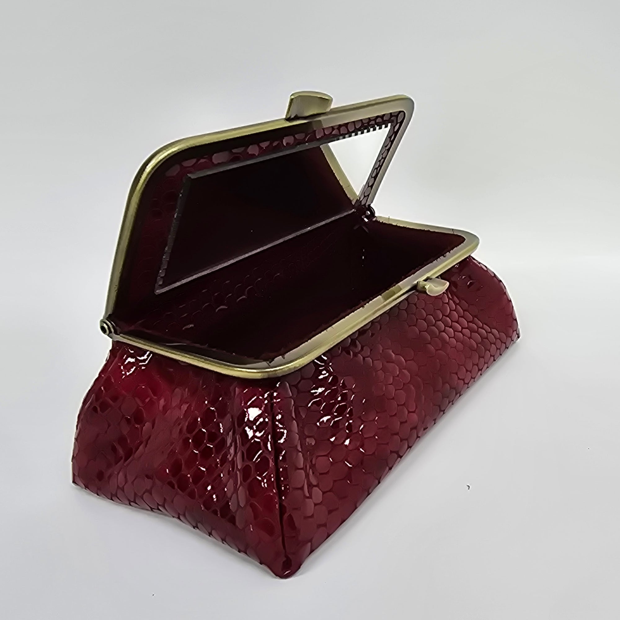 Laquered Red Snake Genuine Leather Travel Bag brushed bronze frame front view opened