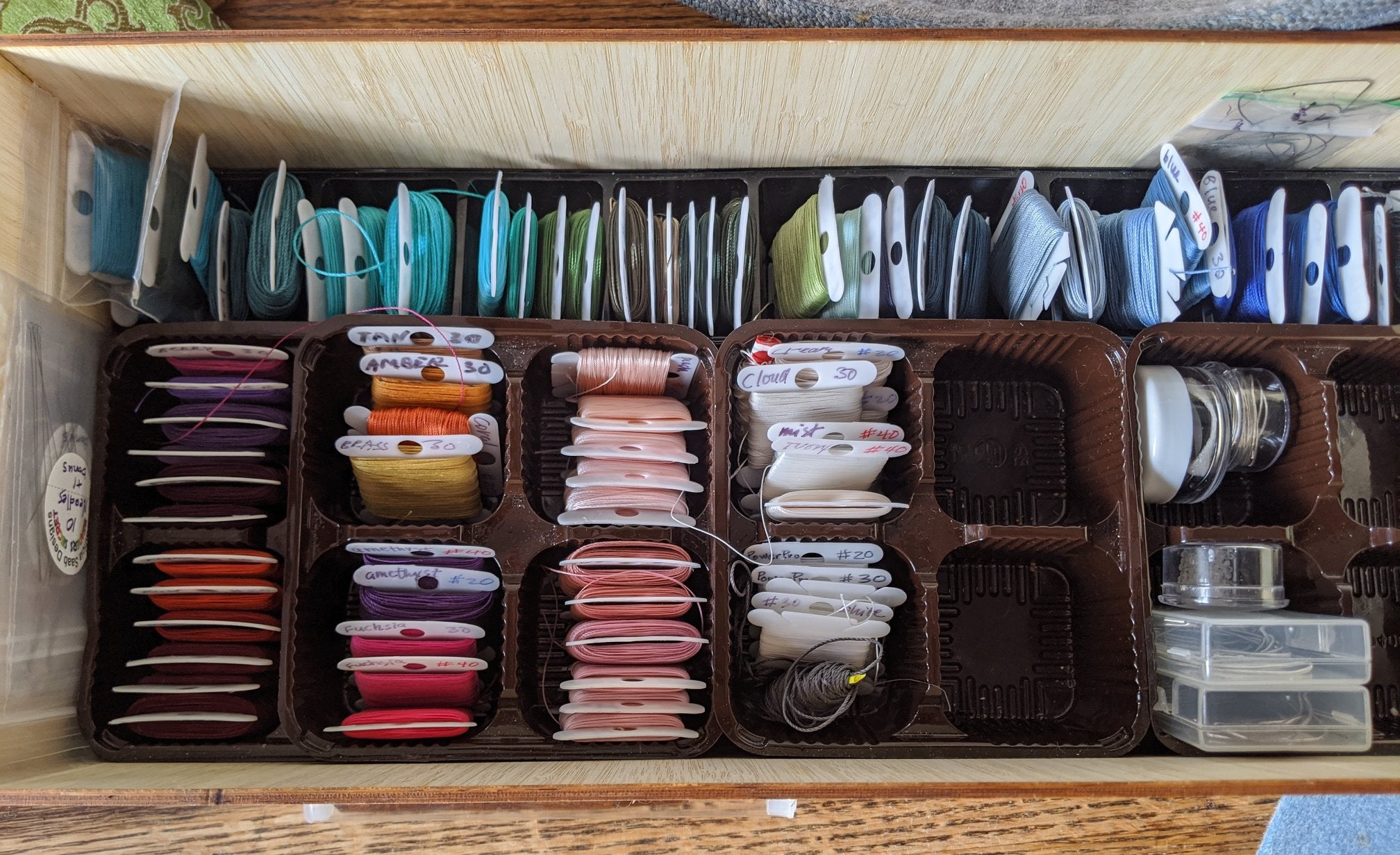 Tools for stringing pearls: thread.