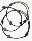 a set of three leather bracelets with beads