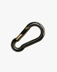 a black and gold metal hook on a white background