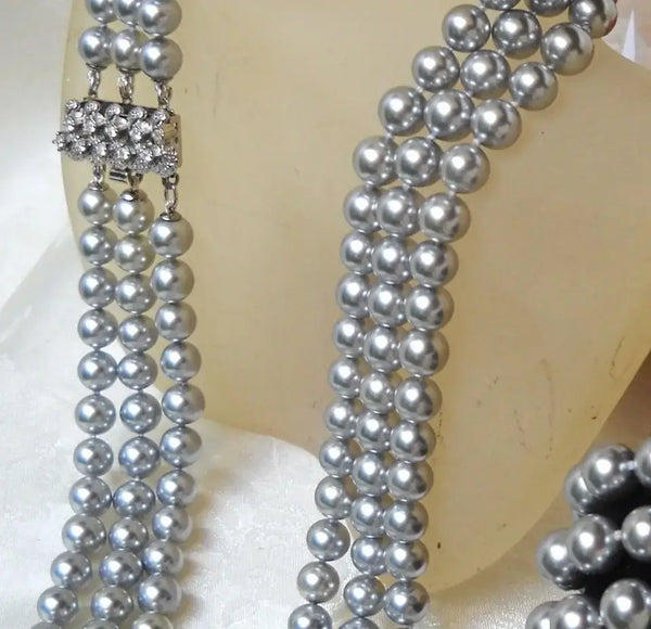 Elegant silver pearl necklace with rhinestone clasp showcasing how to differentiate real pearls