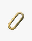 a gold paper clip on a white background