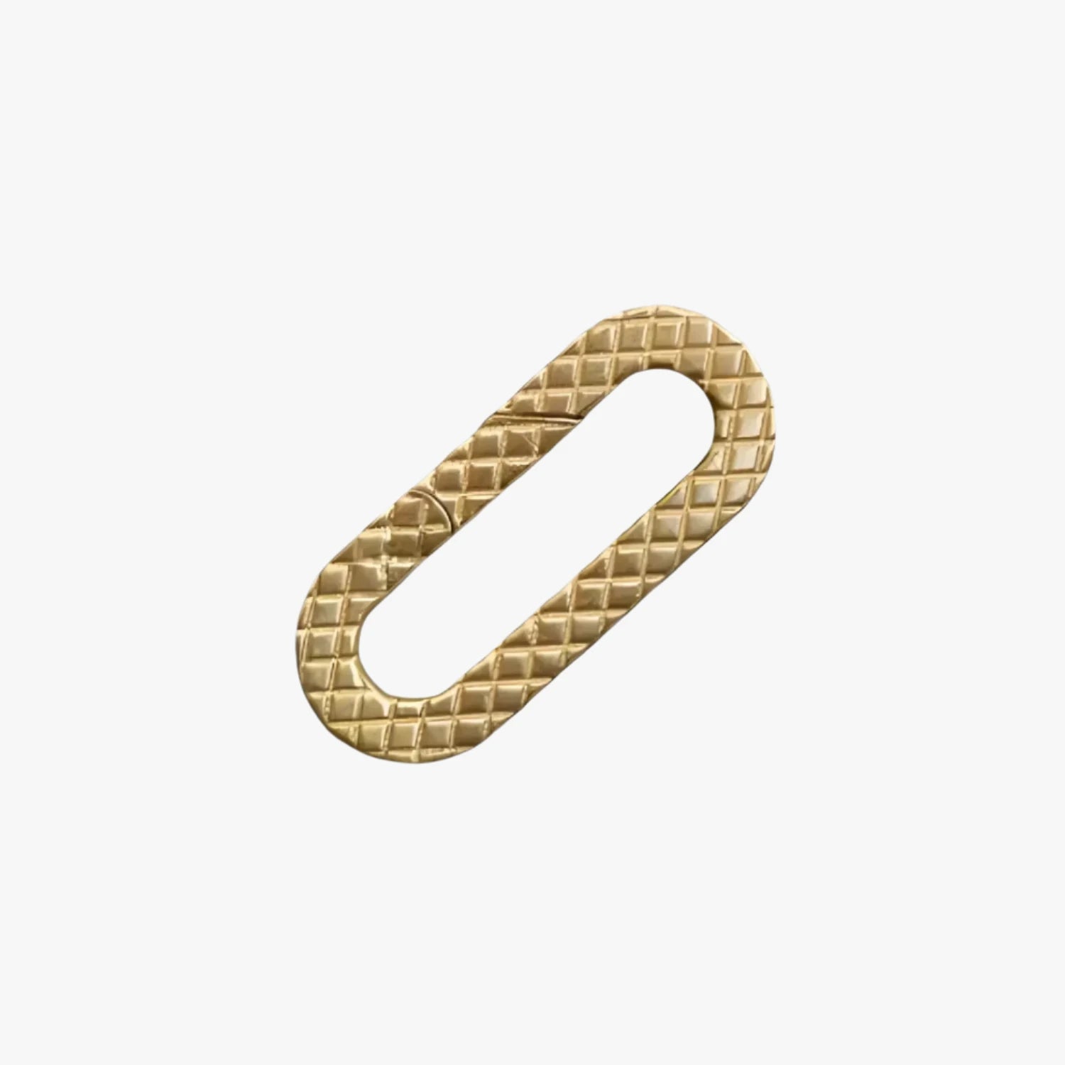 a gold metal clasp on a white background