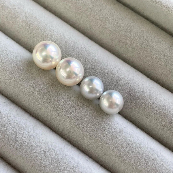 Four lustrous Marina Korneev pearls in a row showcasing exceptional surface quality.