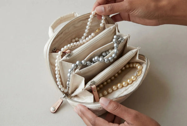 Pearl jewelry organized in a travel case.