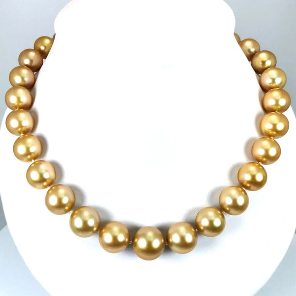 Golden pearl necklace with uniform beads, inspired by Majorica Pearls elegance.