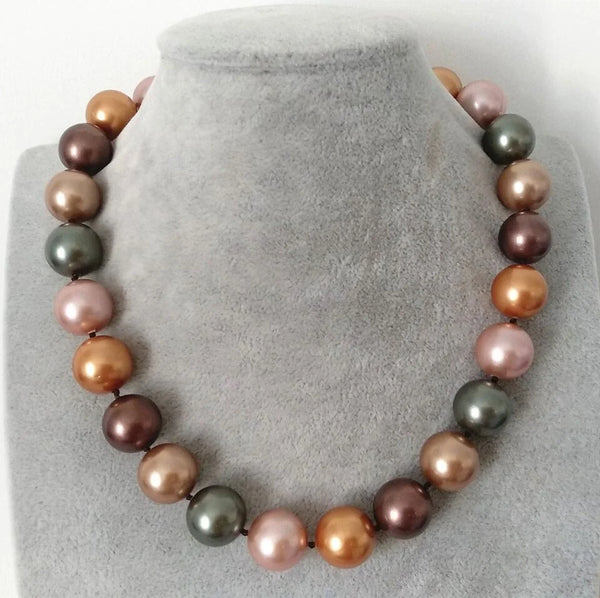 Pearl necklace with multicolored beads to help differentiate real pearls from fake ones.