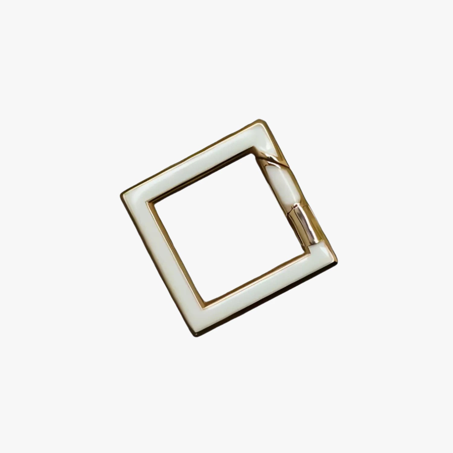 a square metal object with a white background