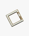 a square metal object with a white background