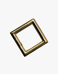 a gold square shaped object on a white background