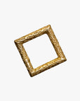 a gold square frame with a pattern on it