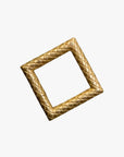 a gold square shaped object on a white background